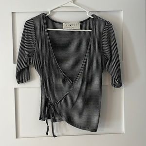 Knit black and white striped wrap style top, size medium